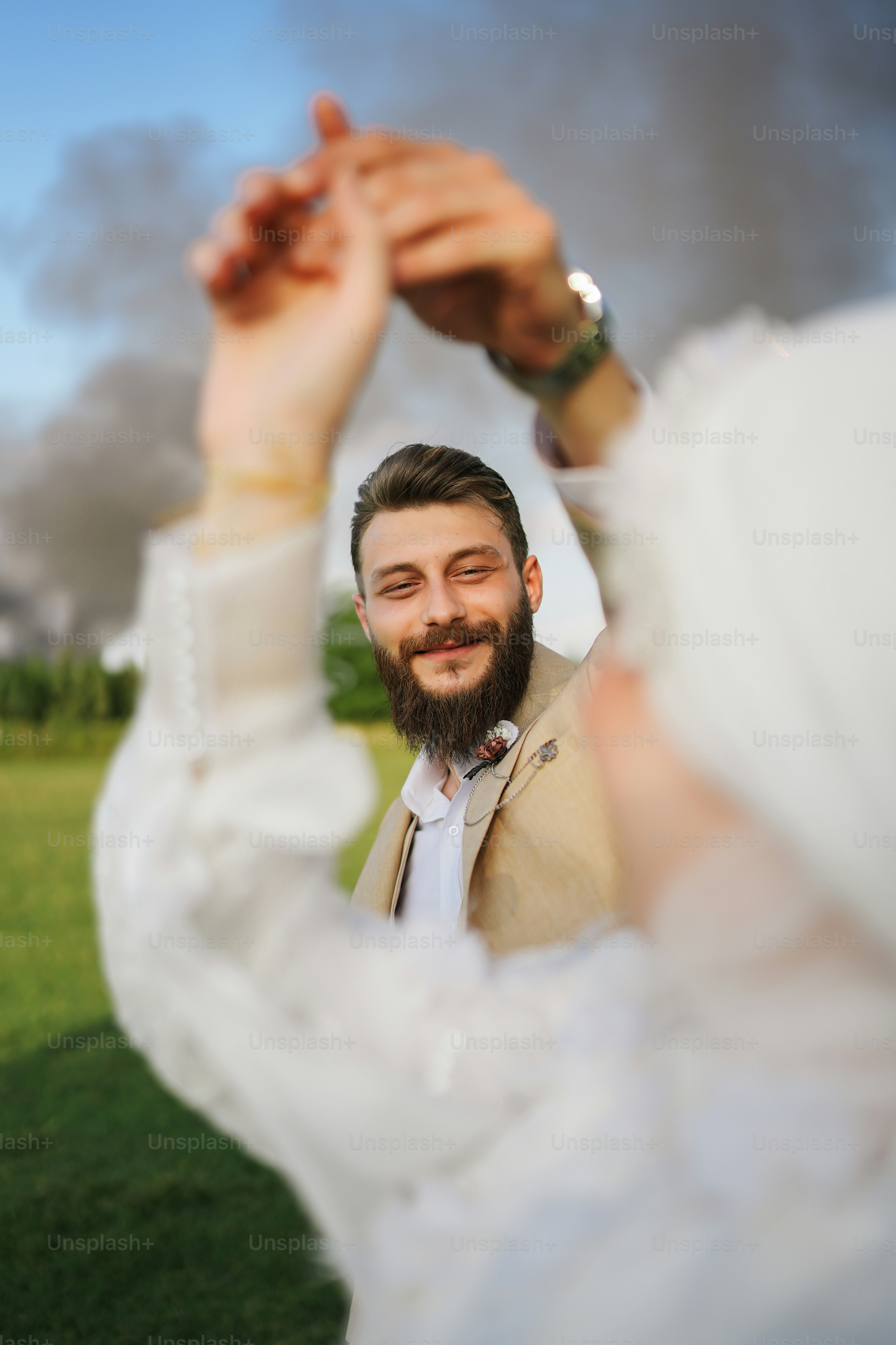 a man with a beard and a white dress