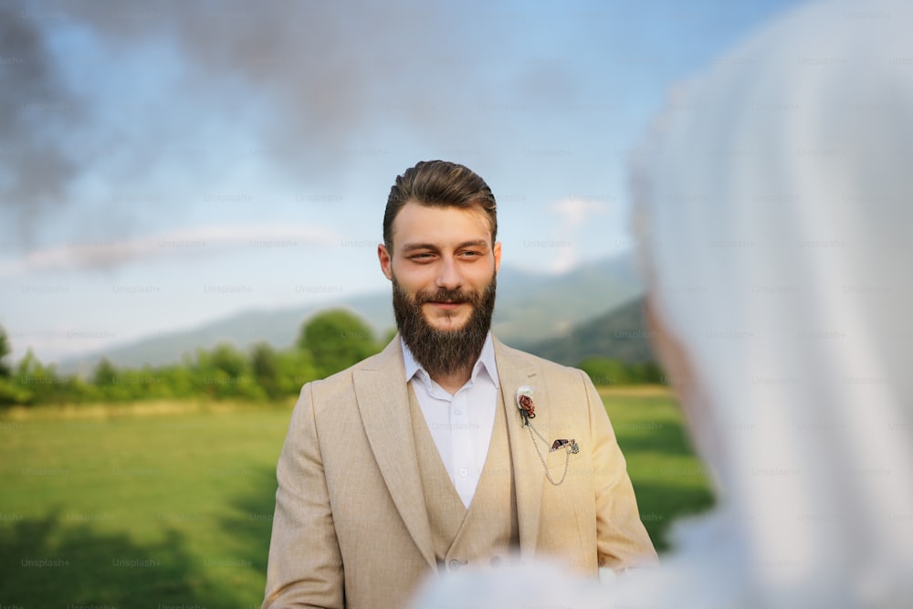 a man with a beard is looking at a woman