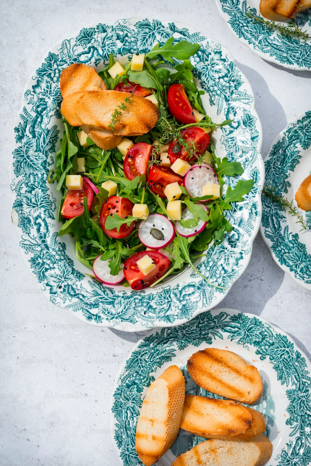 a table topped with plates filled with food