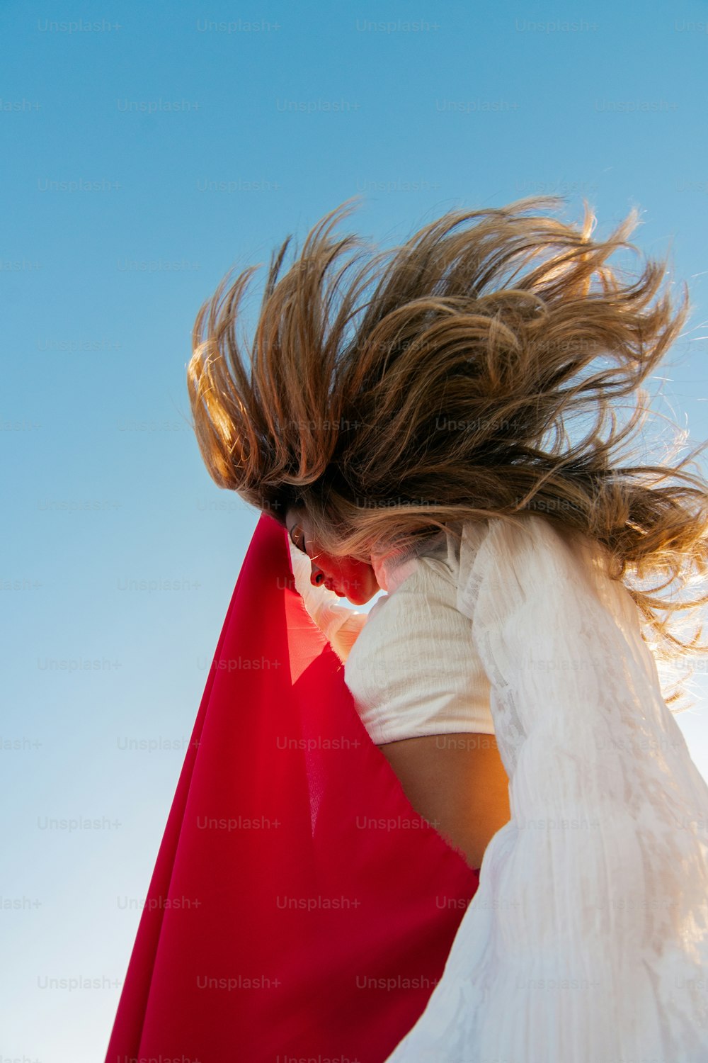 a woman with her hair in the wind