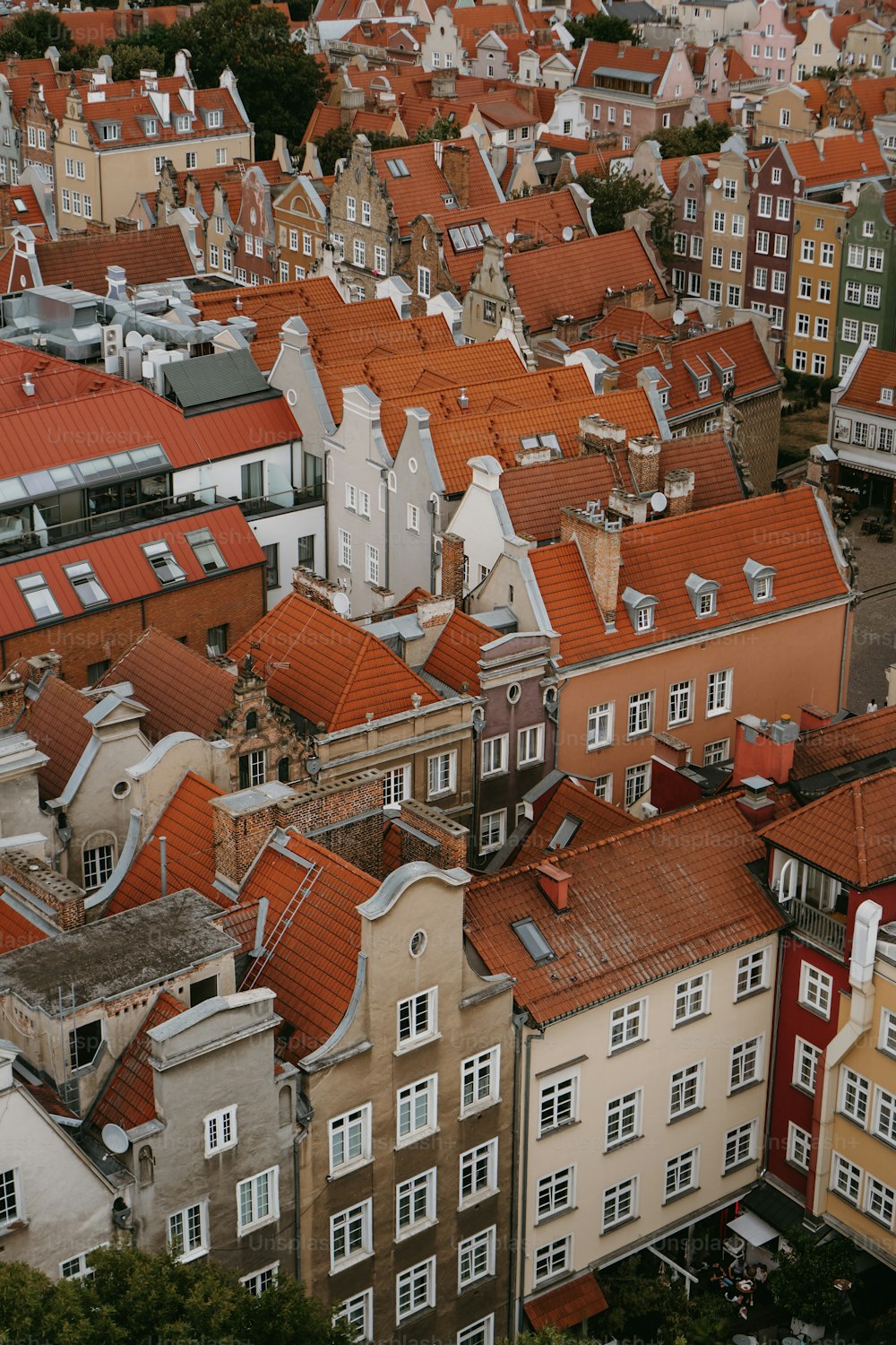 a large group of buildings with red roofs