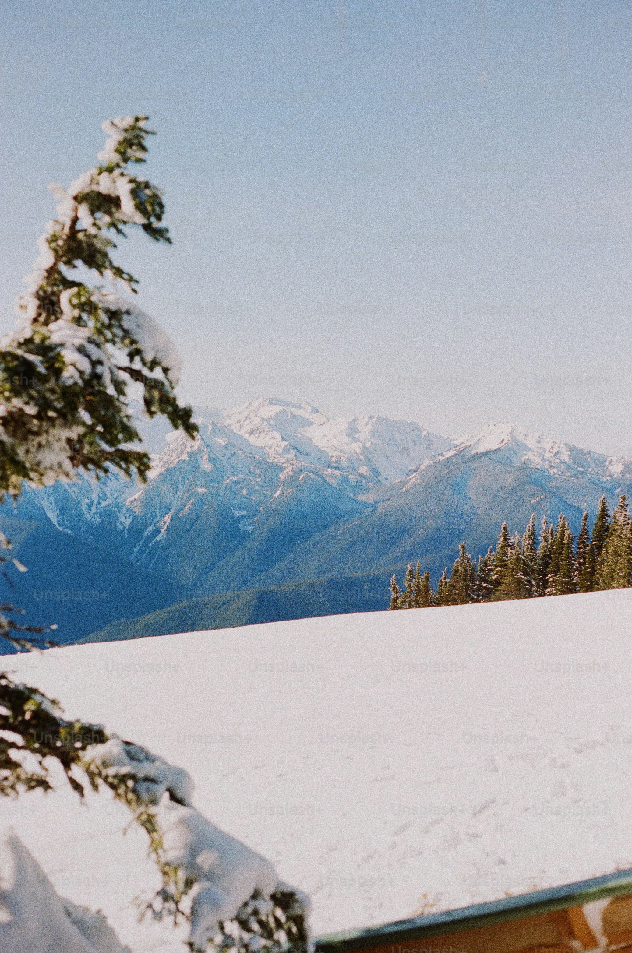 a man riding skis on top of a snow covered slope