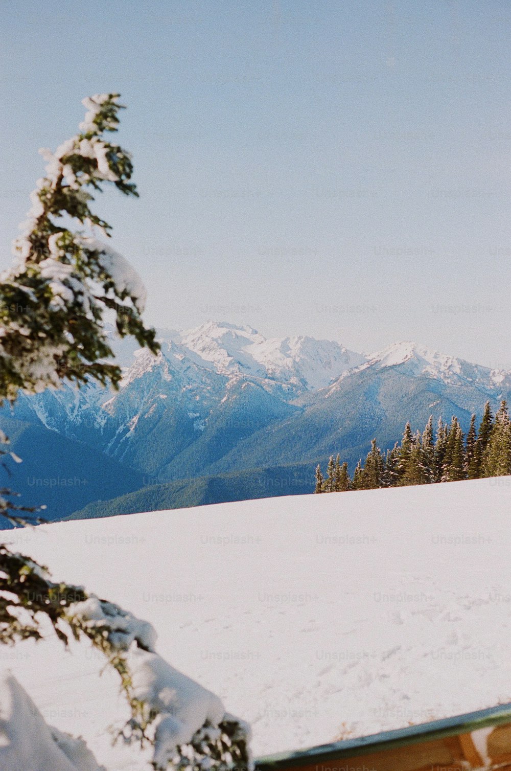 a man riding skis on top of a snow covered slope