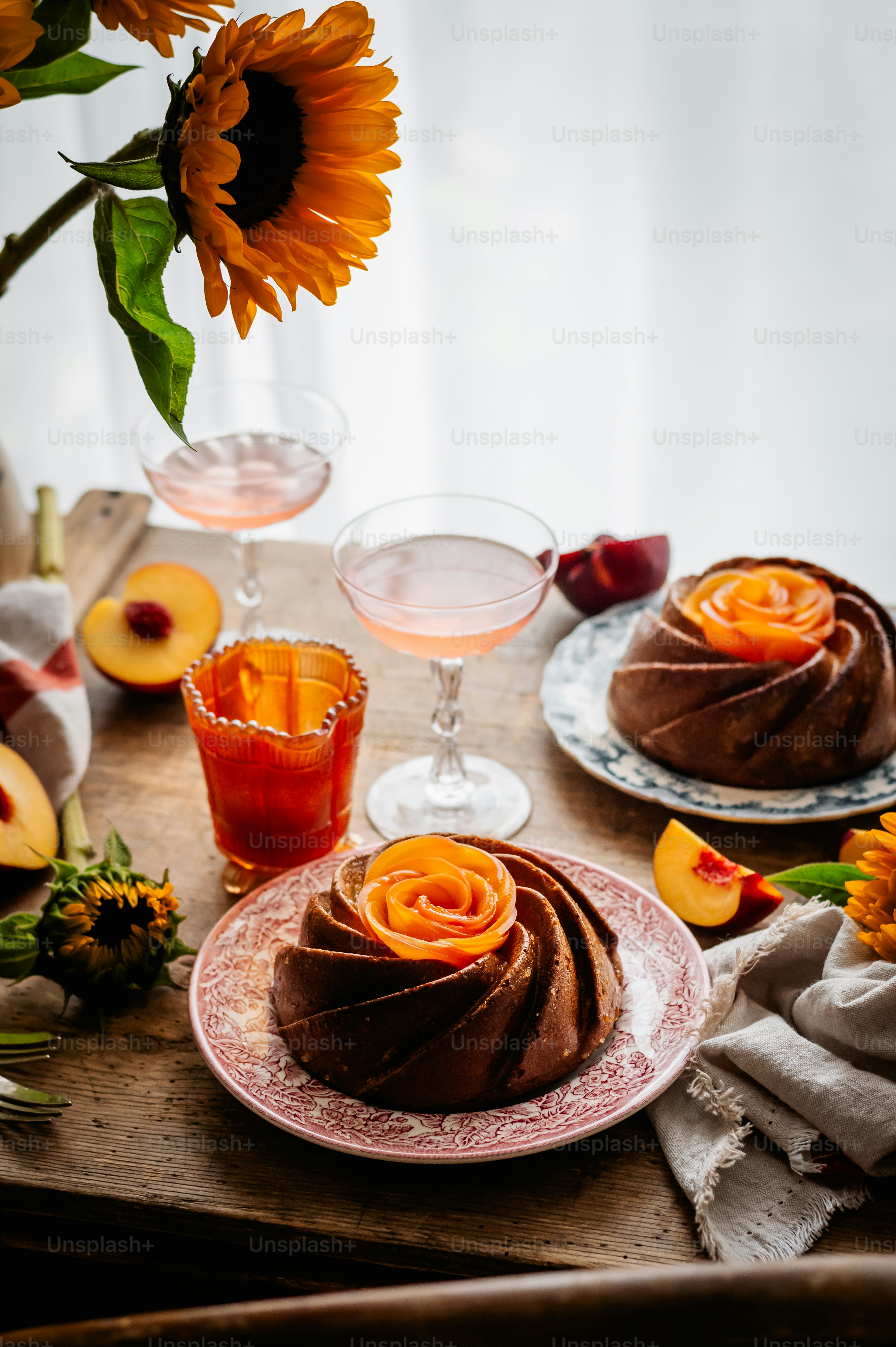 a table topped with a cake covered in frosting