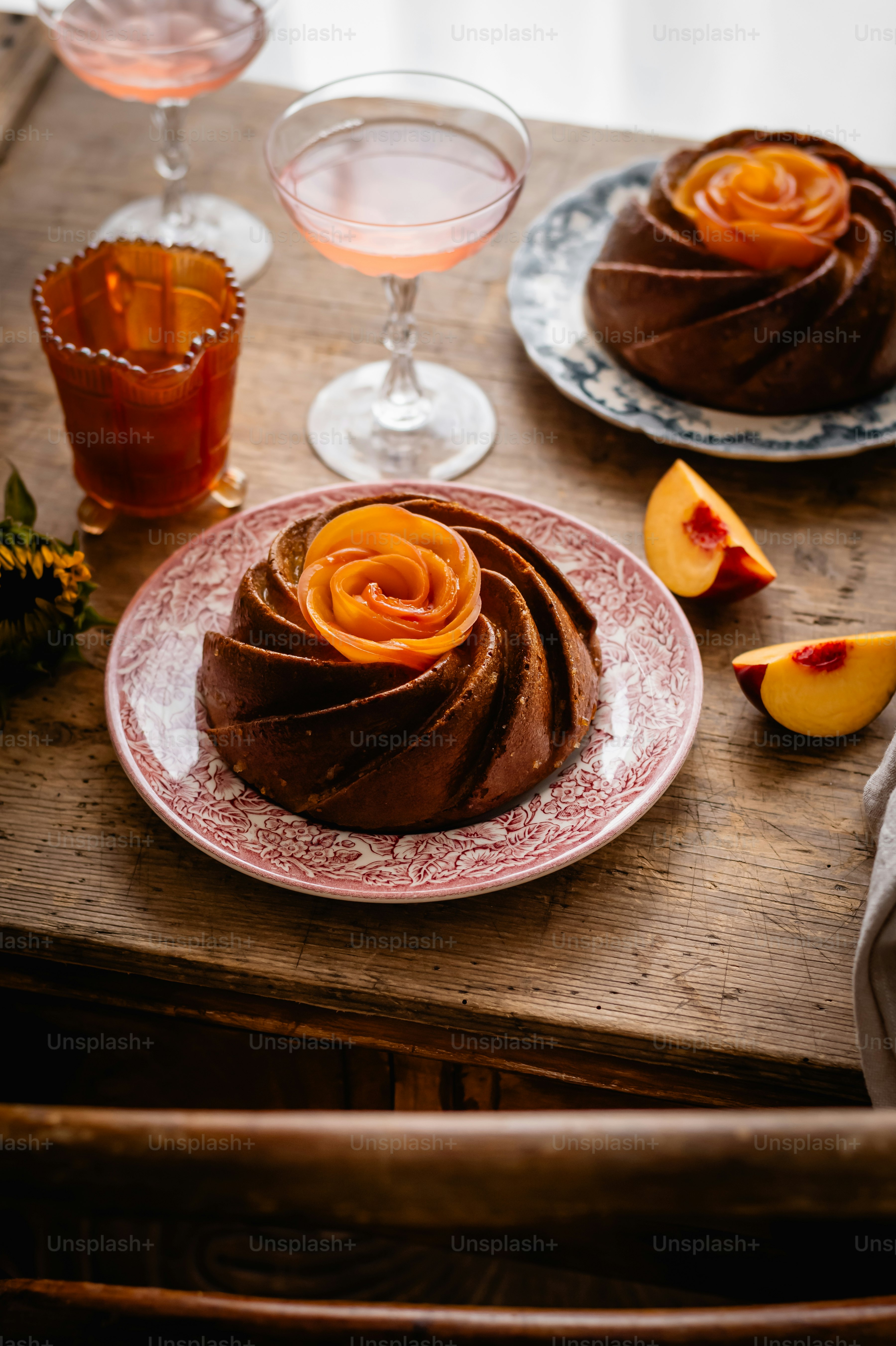 a table topped with a cake covered in chocolate frosting