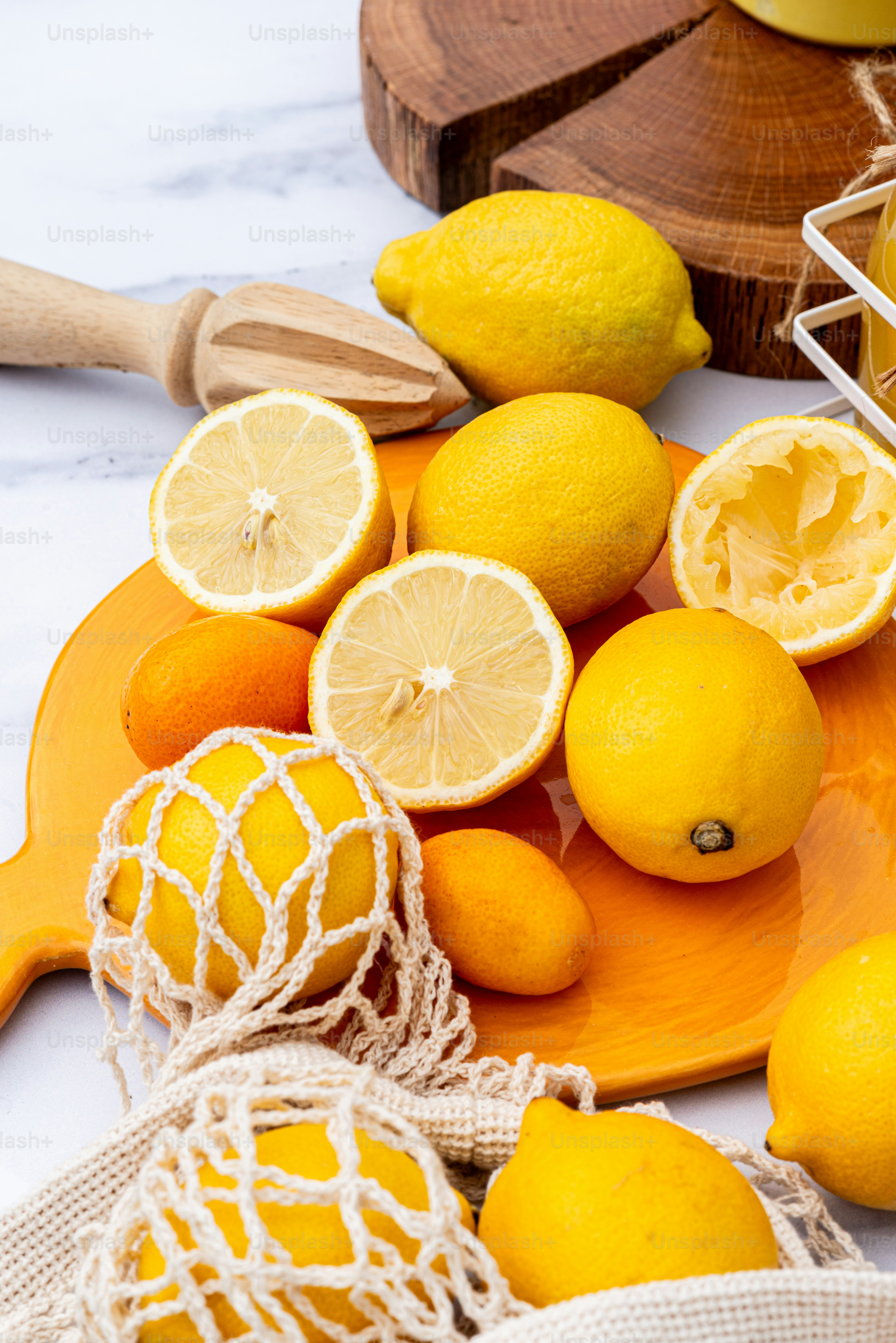 a bunch of lemons sitting on top of a cutting board