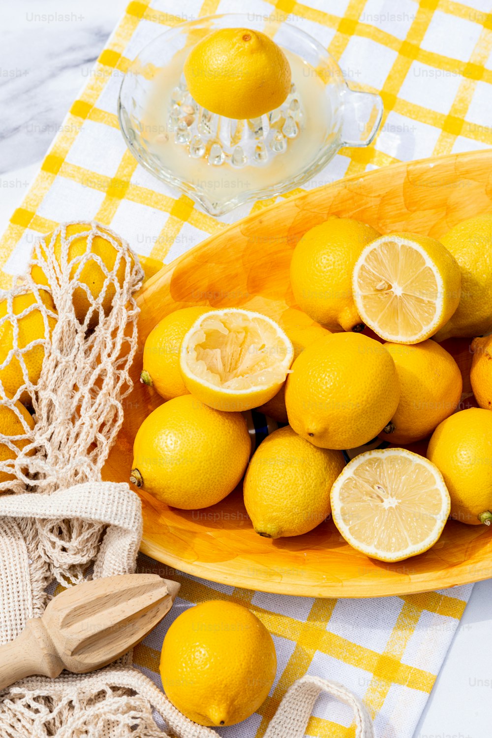 a bowl of lemons on a table