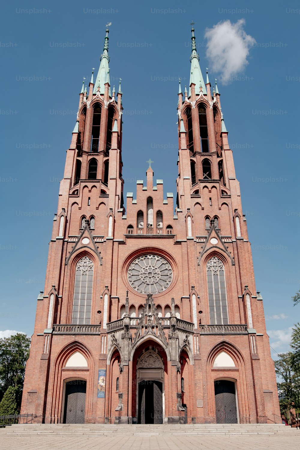 a very tall church with a clock on it's side