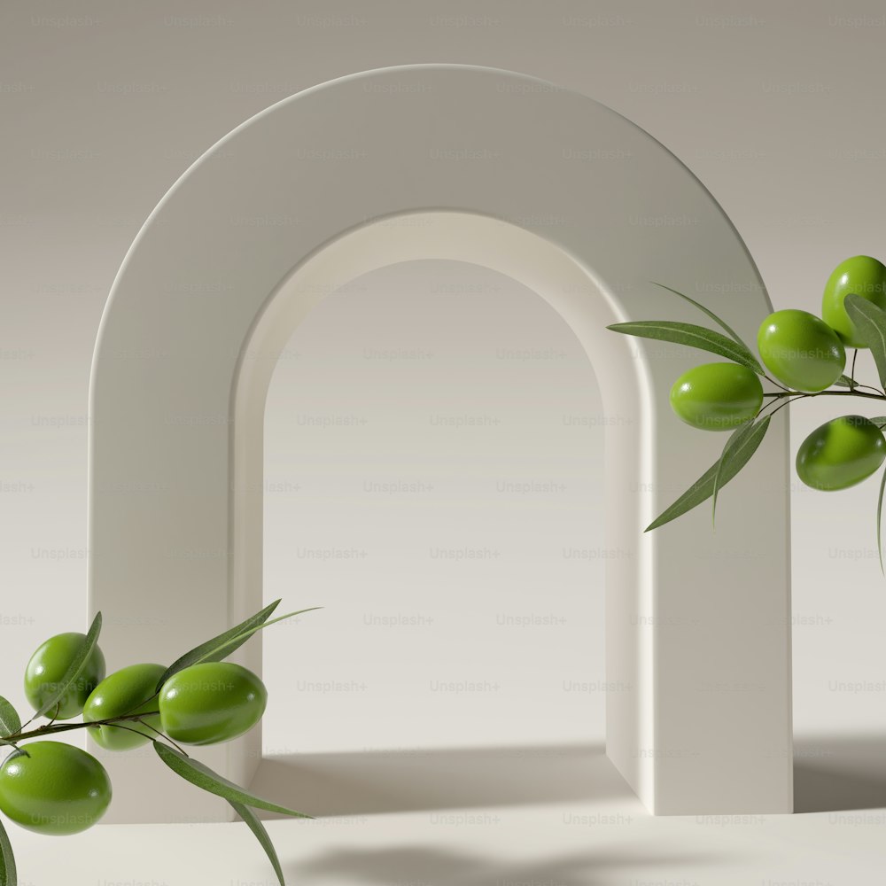 a white arch with some green olives on it