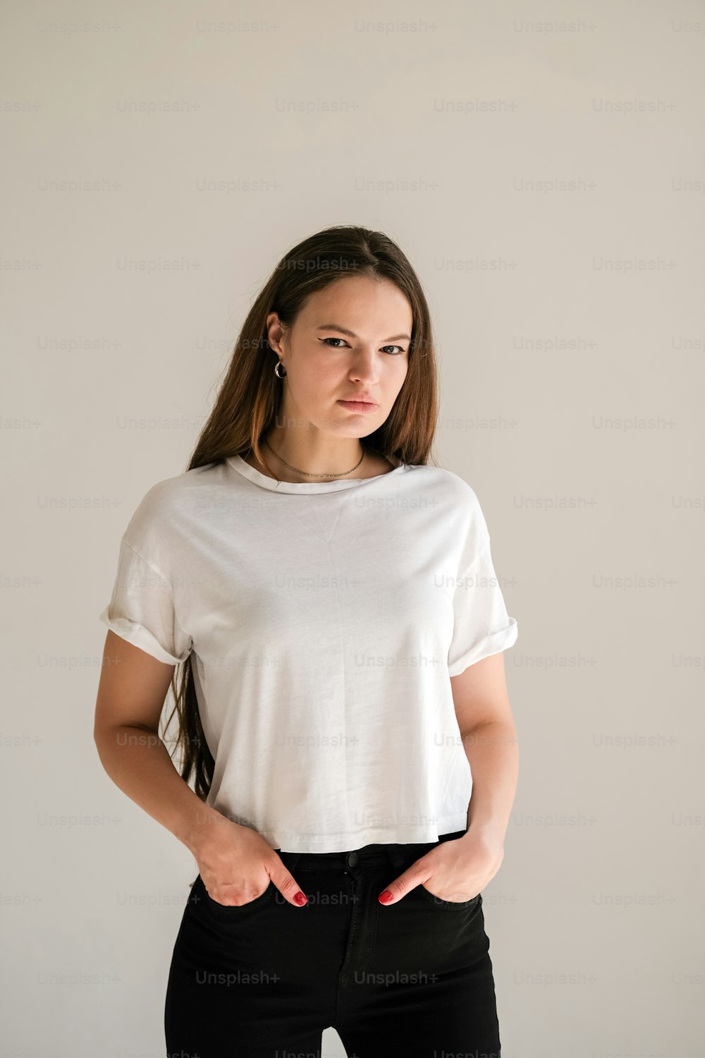 A Teenage Girl In White Jeans And A Black Shirt Stock Photo - Download  Image Now - Teenage Girls, White Background, White Color - iStock