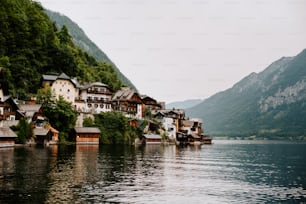 a row of houses sitting on the side of a lake