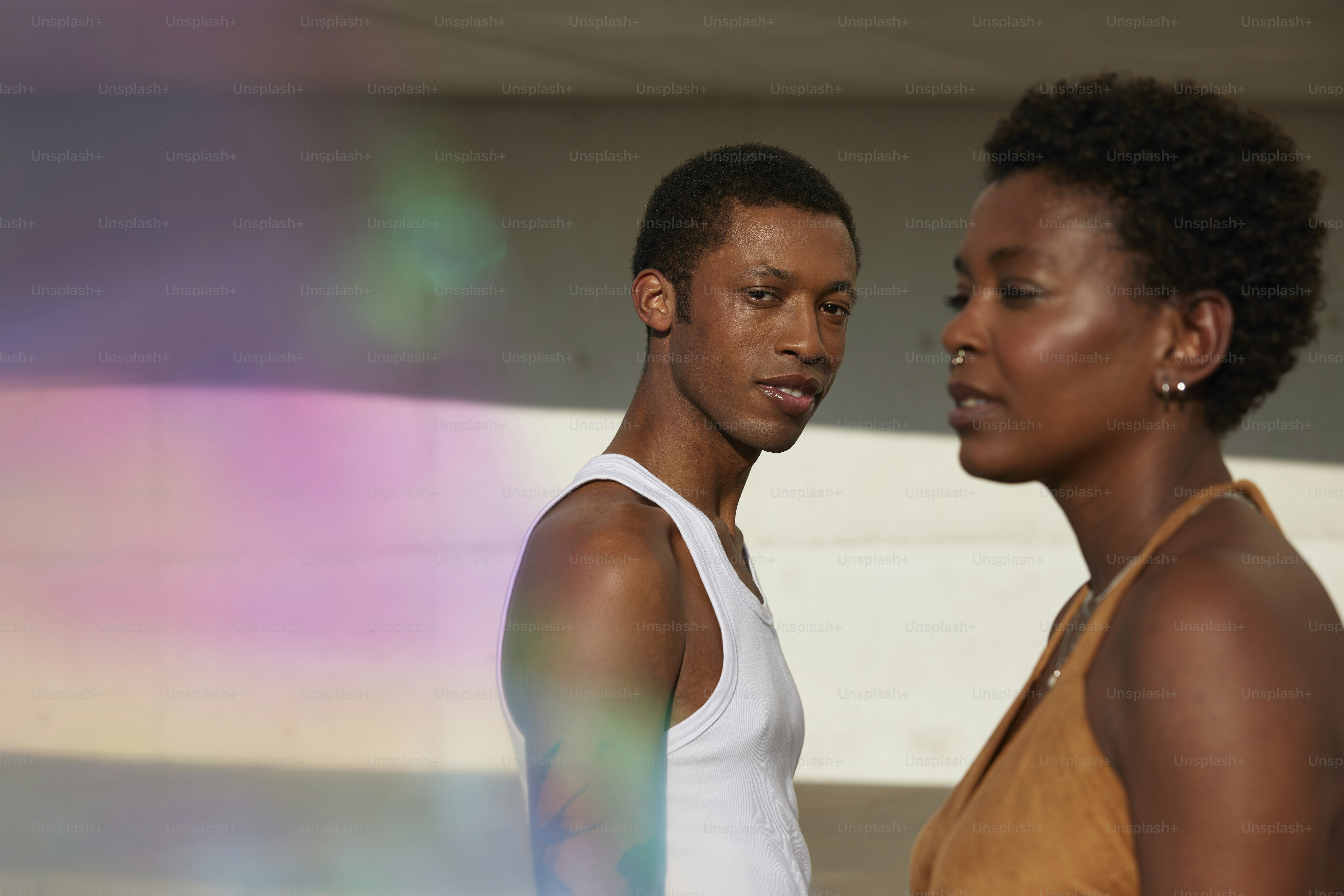 a man and a woman standing next to each other