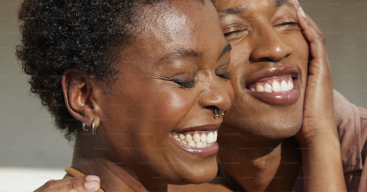 A man and a woman embracing each other photo – Expressive moments Image ...