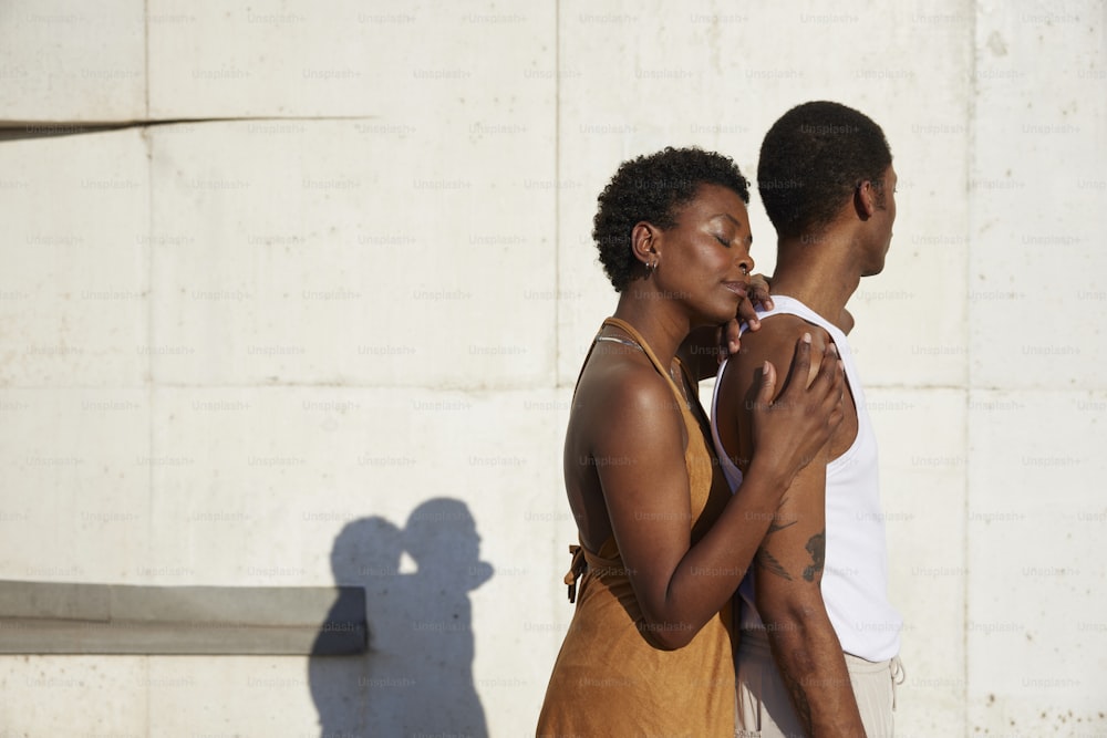 a man and a woman embracing each other