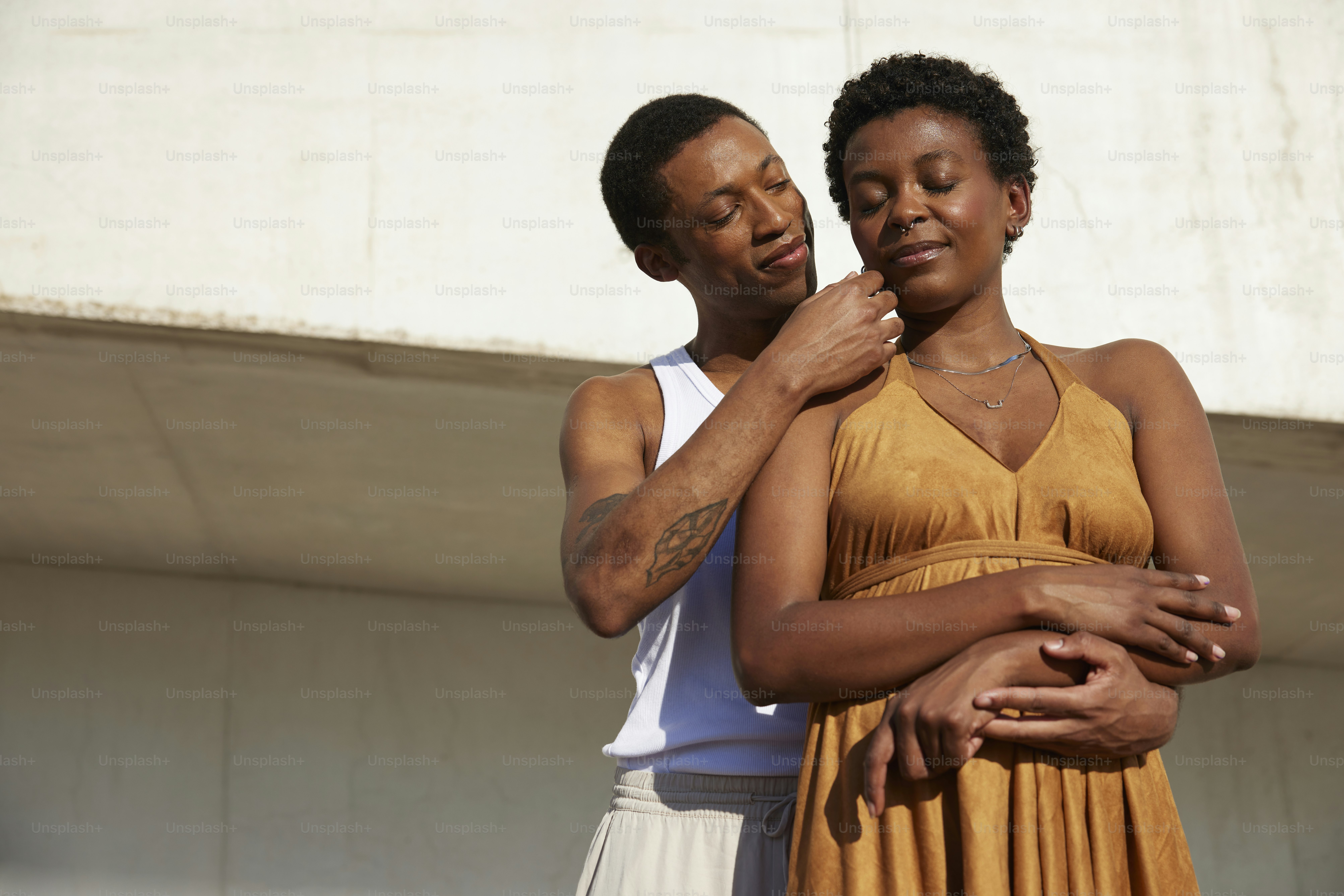 a couple of people standing next to each other