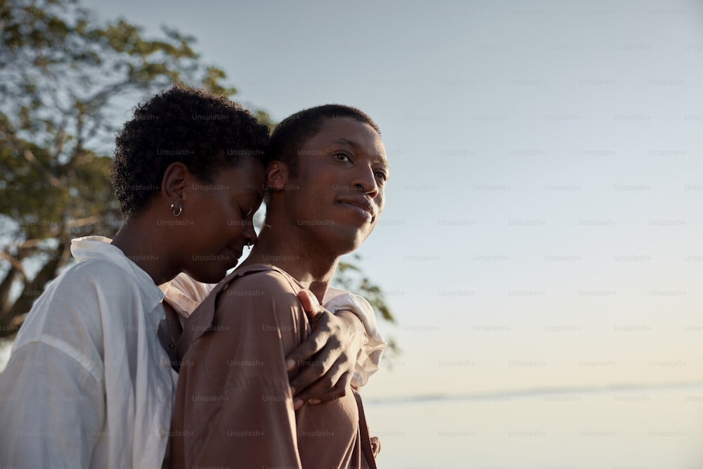 a man and a woman standing next to each other