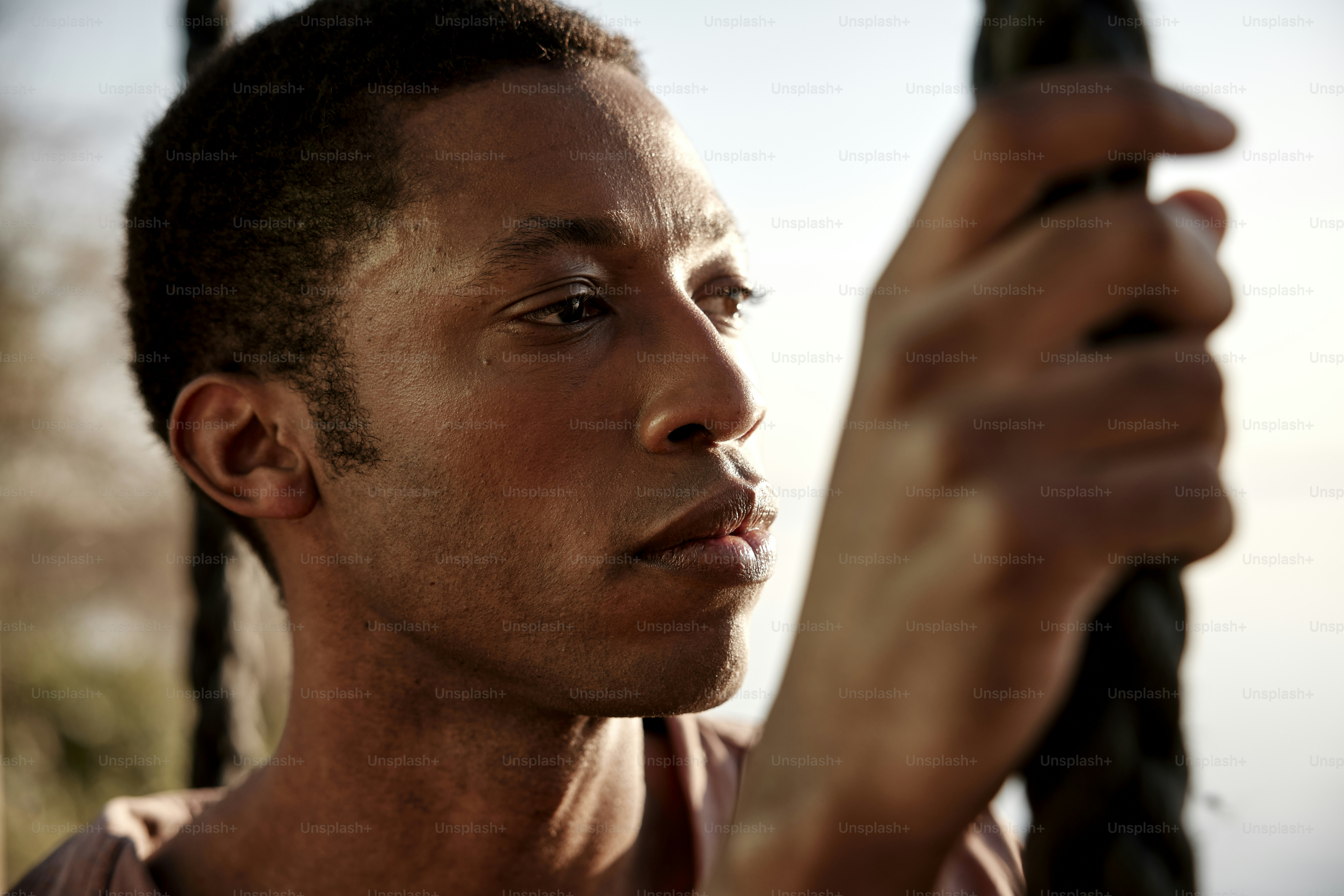 a man holding a cell phone up to his ear