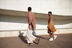 a man and a woman walking down a street