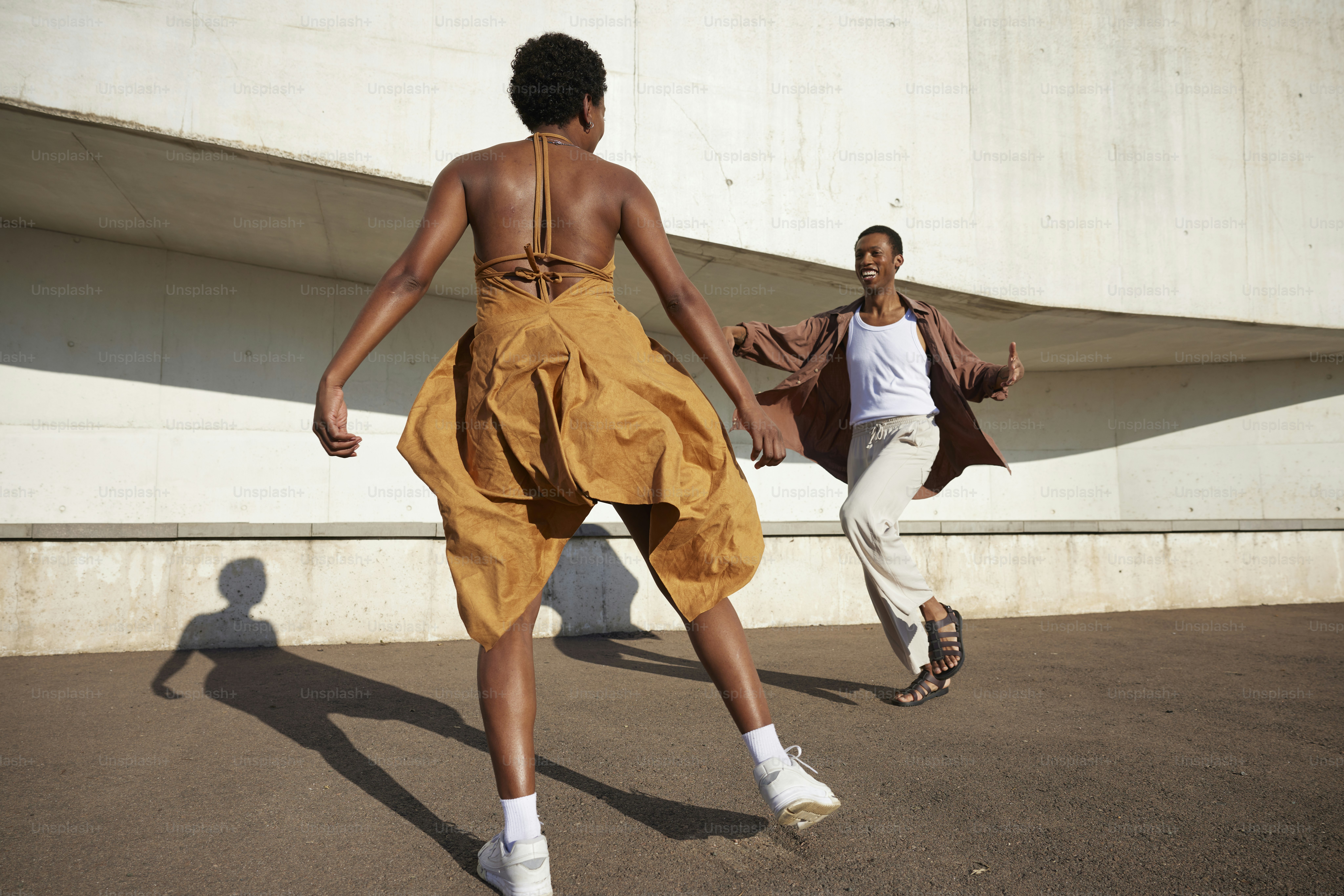 two men playing a game of frisbee outside