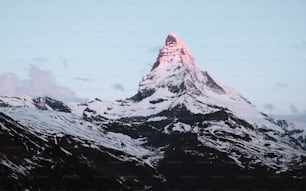 a snow covered mountain with a sky background