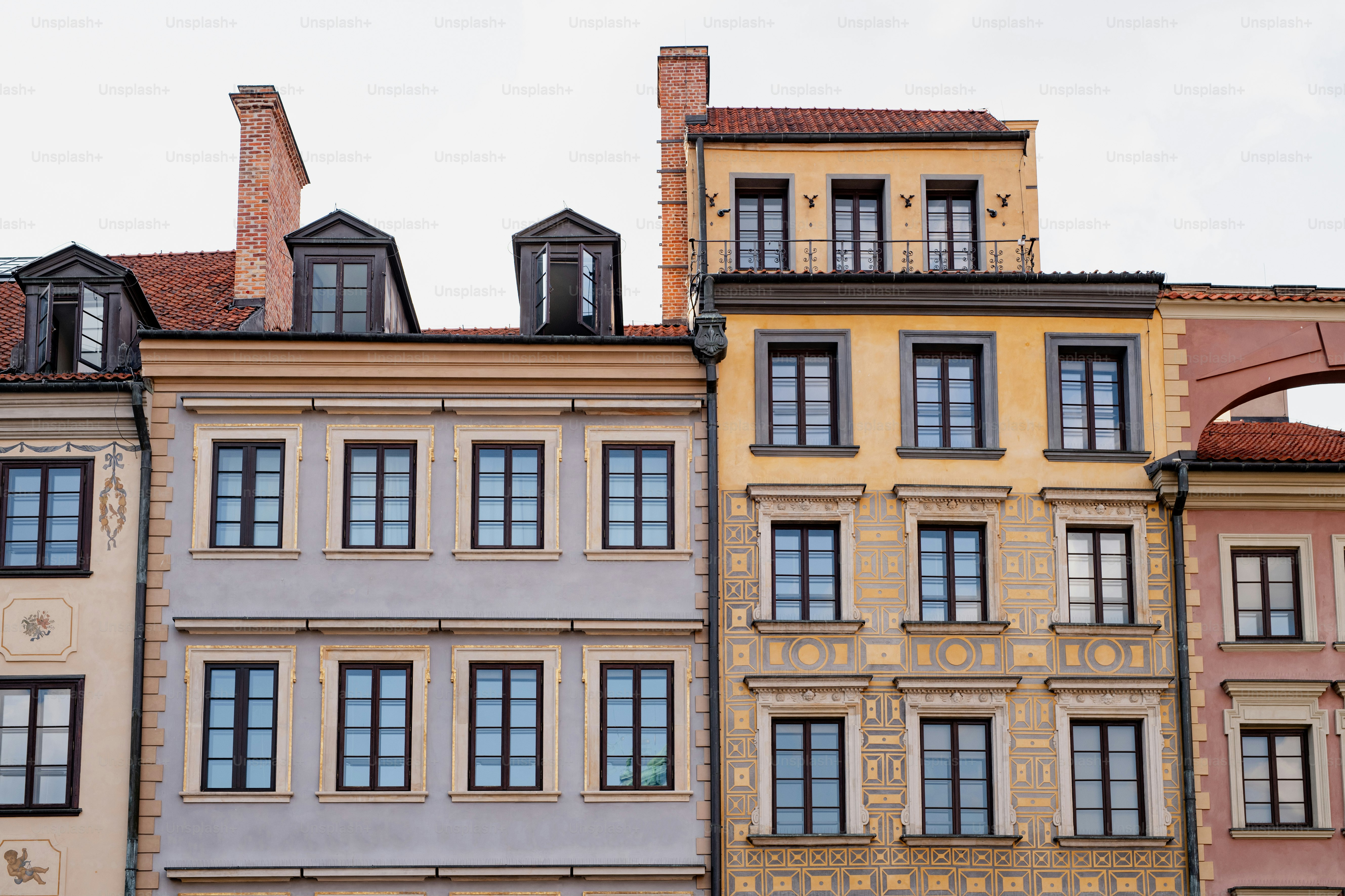 a row of multicolored buildings next to each other