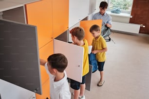 a group of young boys standing next to each other