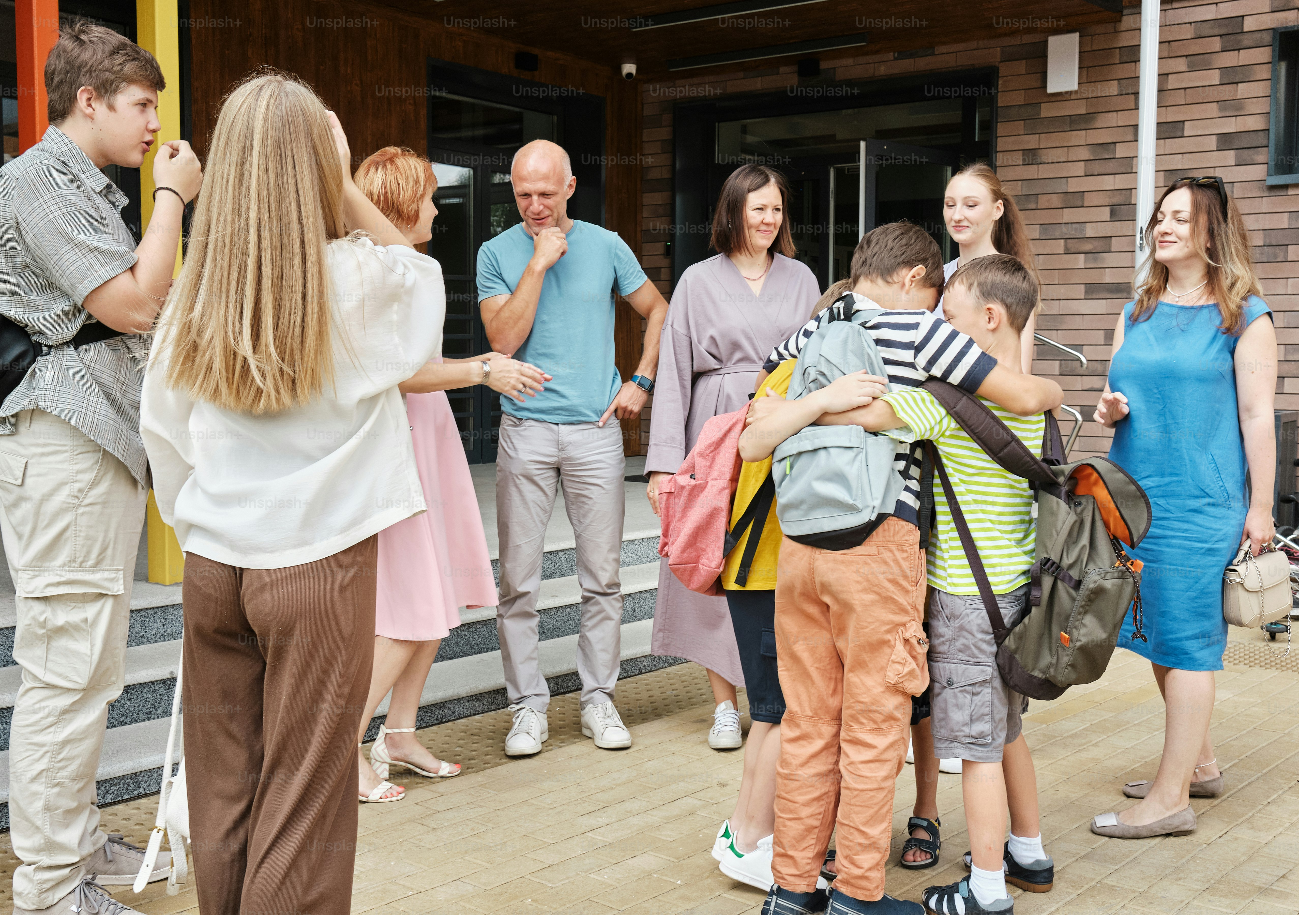 a group of people standing outside of a building