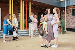 a group of people standing in front of a building