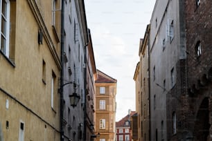 a narrow city street lined with tall buildings