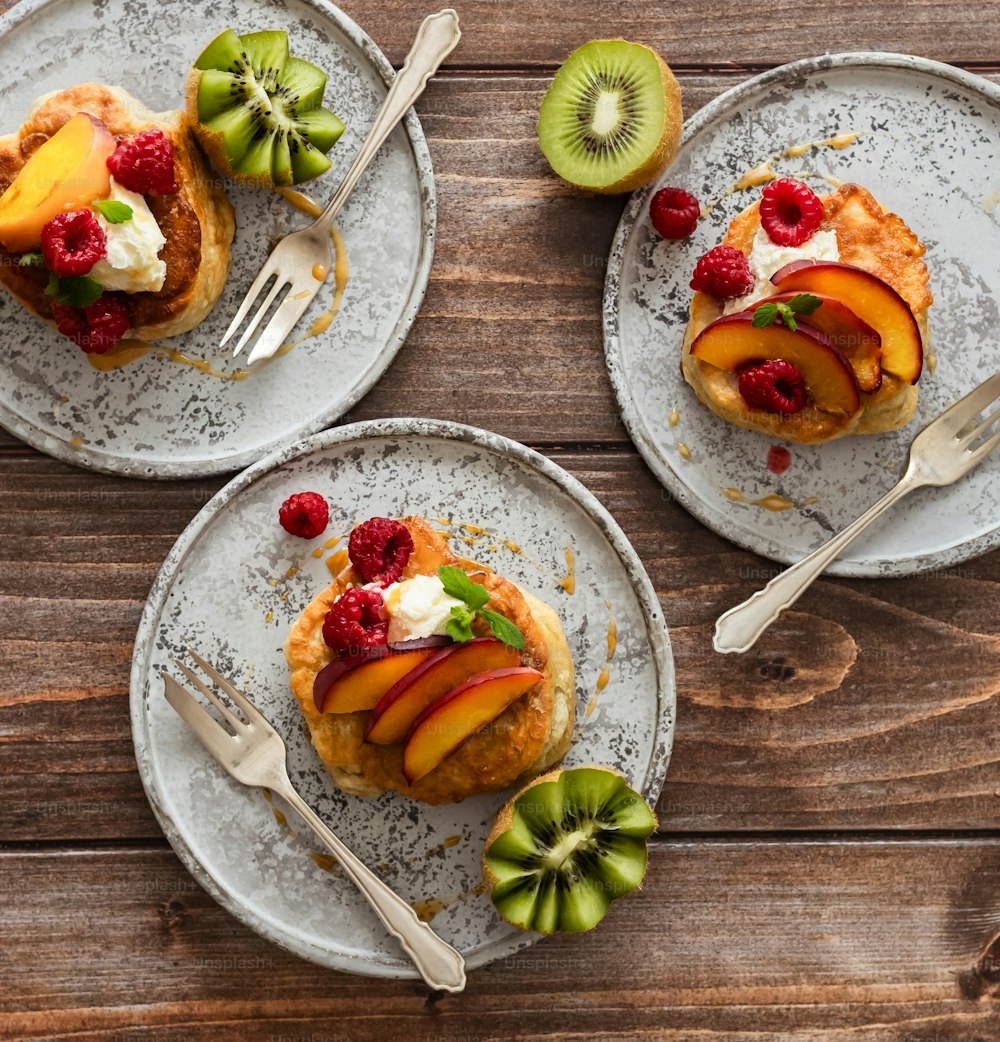 a couple of plates with some fruit on them