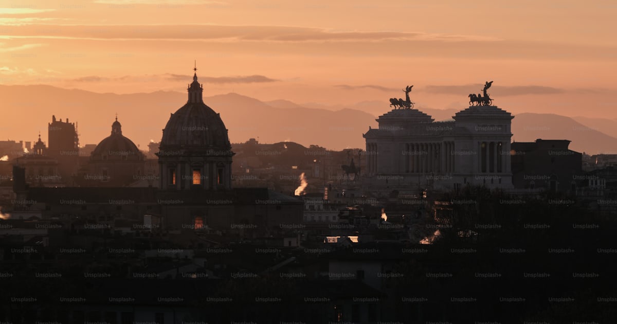 The sun is setting over the city of rome photo – Rome Image on Unsplash