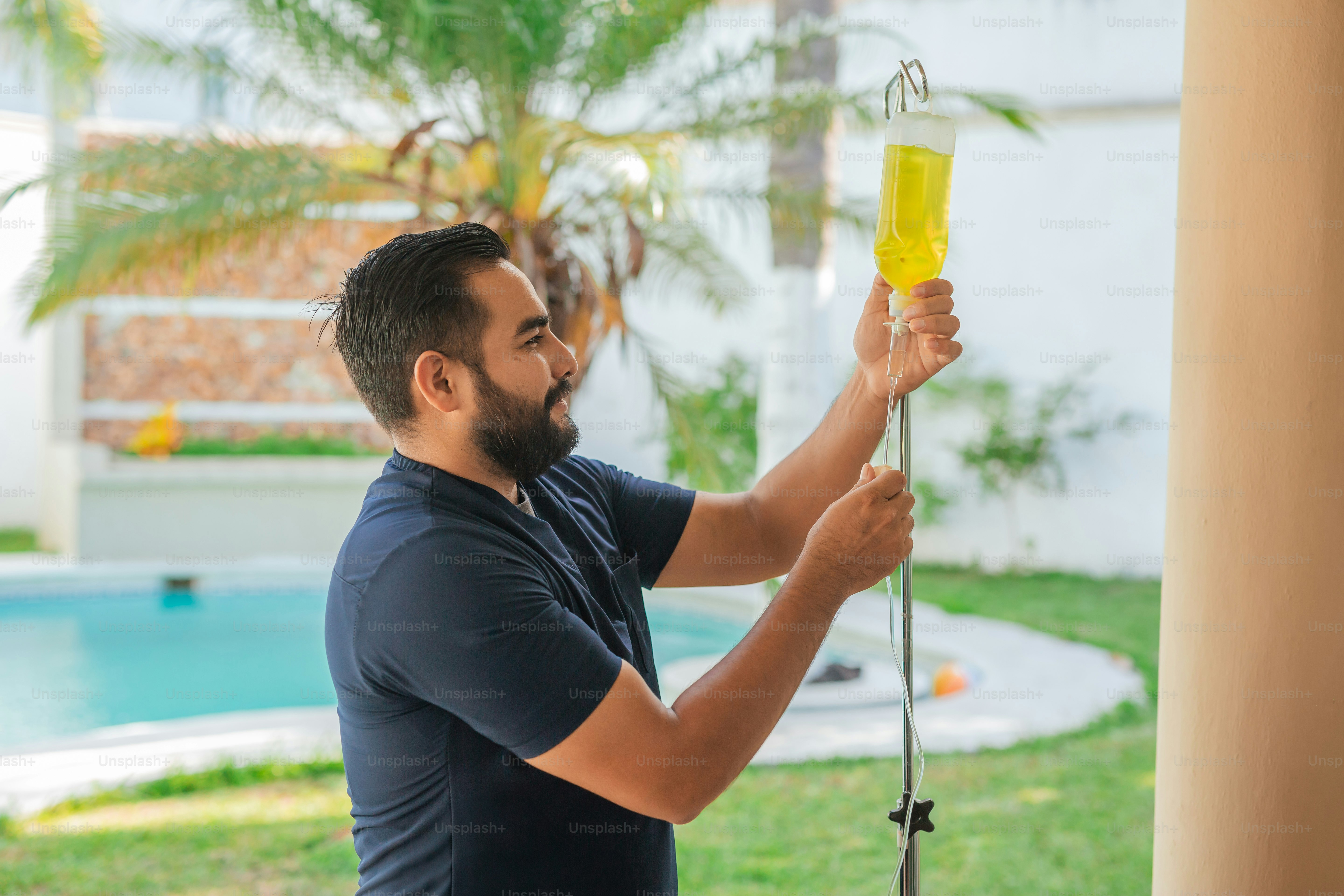 a man holding a yellow object in his hand
