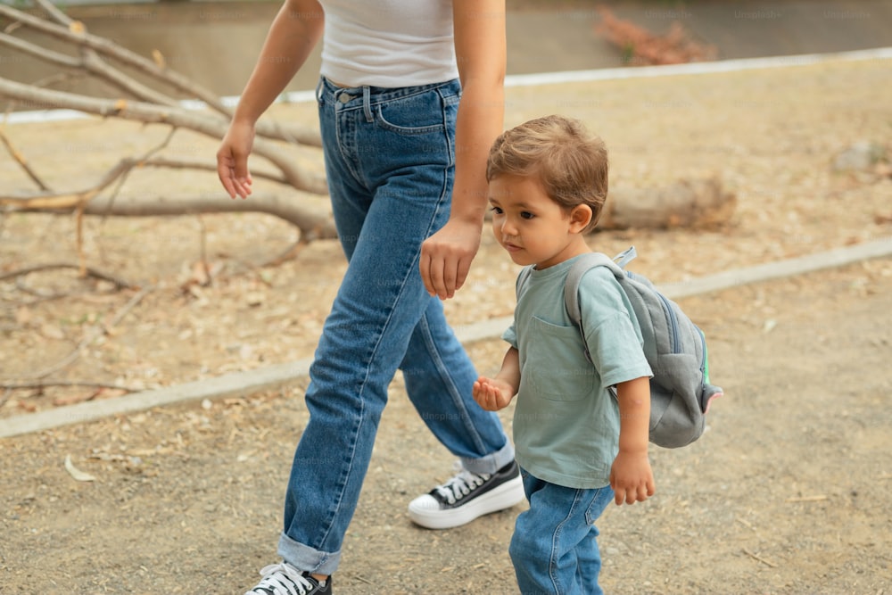 a woman and a small child walking together