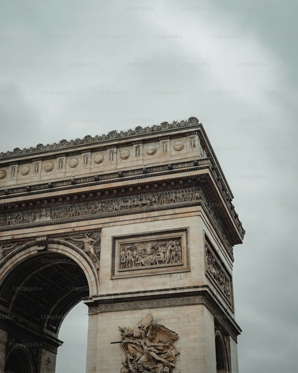 a very tall tower with a clock on it's side