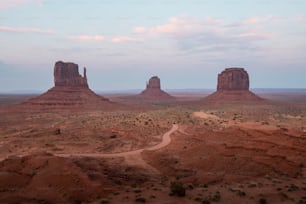 a dirt road in the middle of a desert