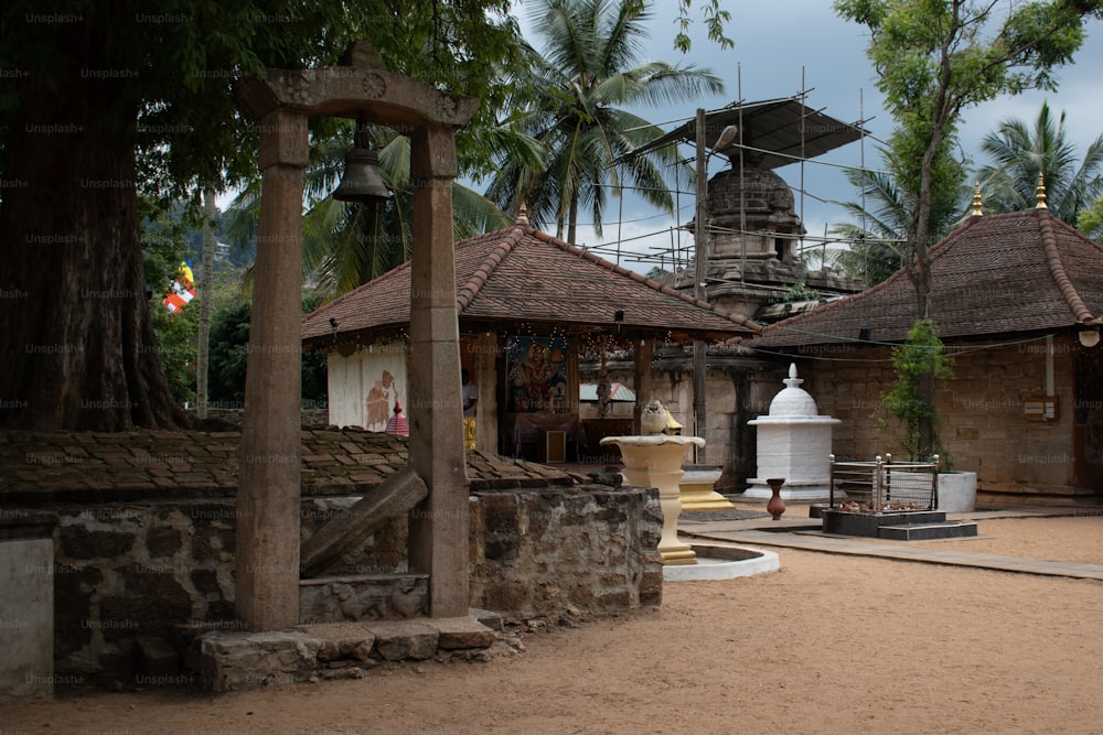 a stone building with a bell tower in the background