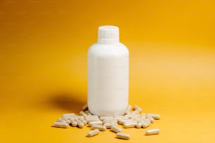 a bottle of milk sitting on top of a pile of pills