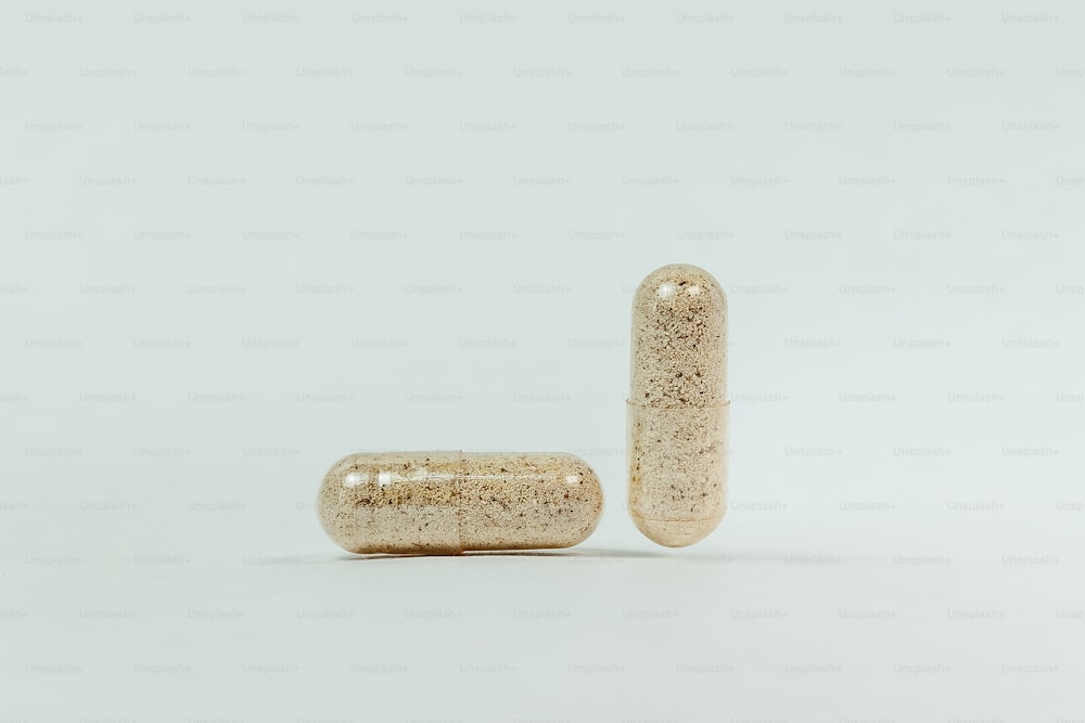 a pair of pills sitting next to each other