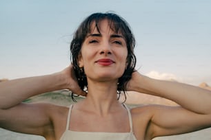 a woman with her hands on her ears