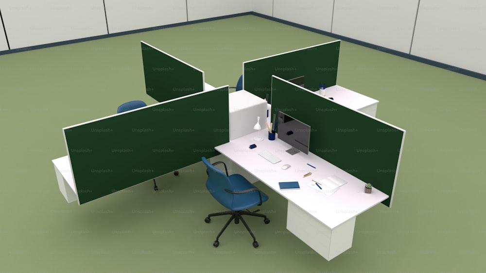 um cubículo de escritório com duas telas verdes e uma cadeira azul
