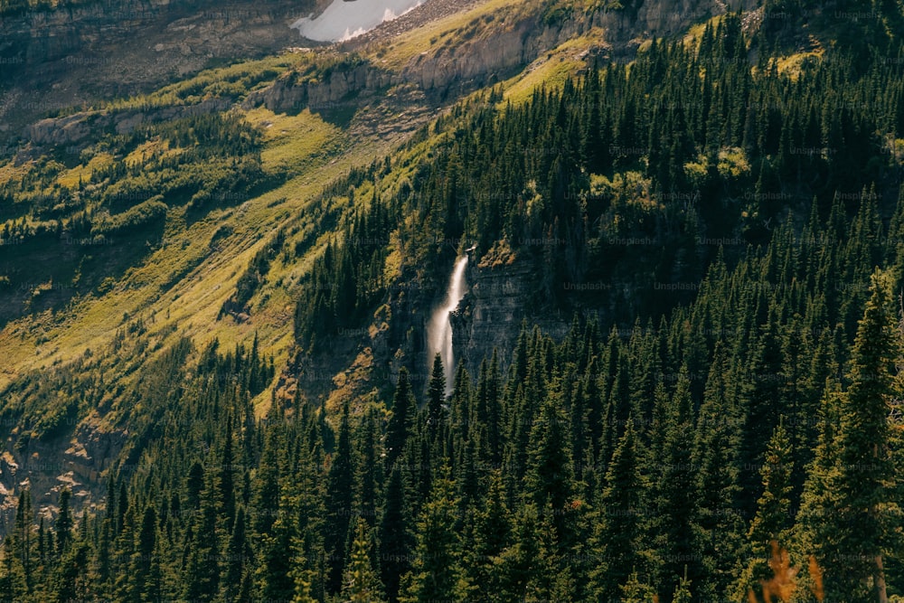 a mountain with a waterfall in the middle of it