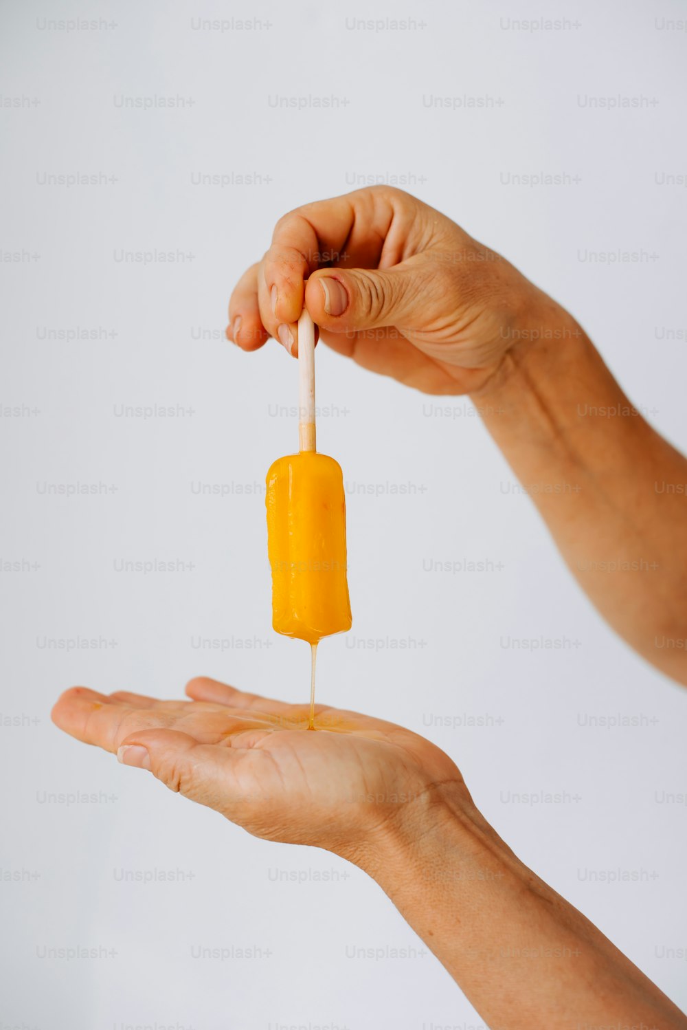 a person holding a piece of food in their hand