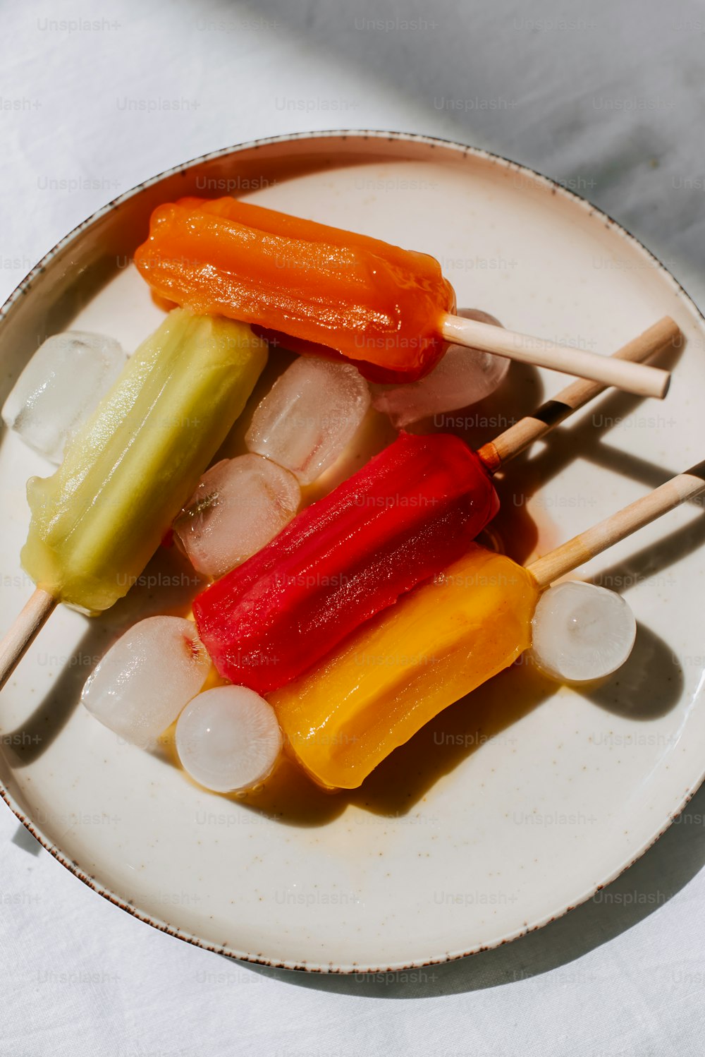 a white plate topped with cut up vegetables