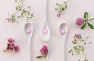a couple of spoons with flowers on them