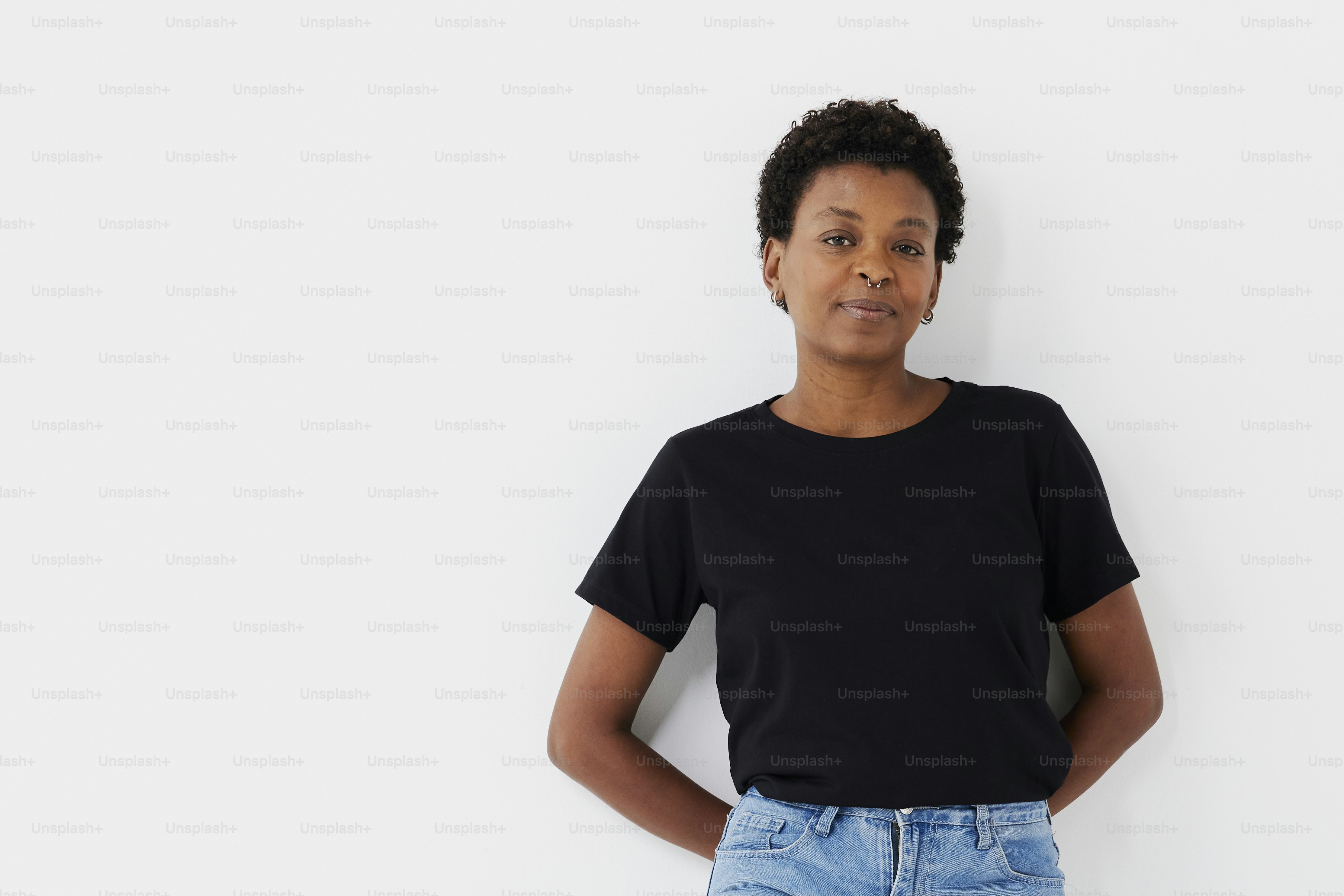 a woman standing with her hands on her hips