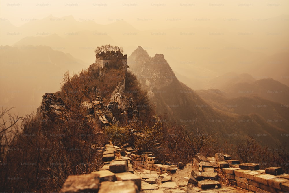 a view of the great wall of china from the top of a mountain