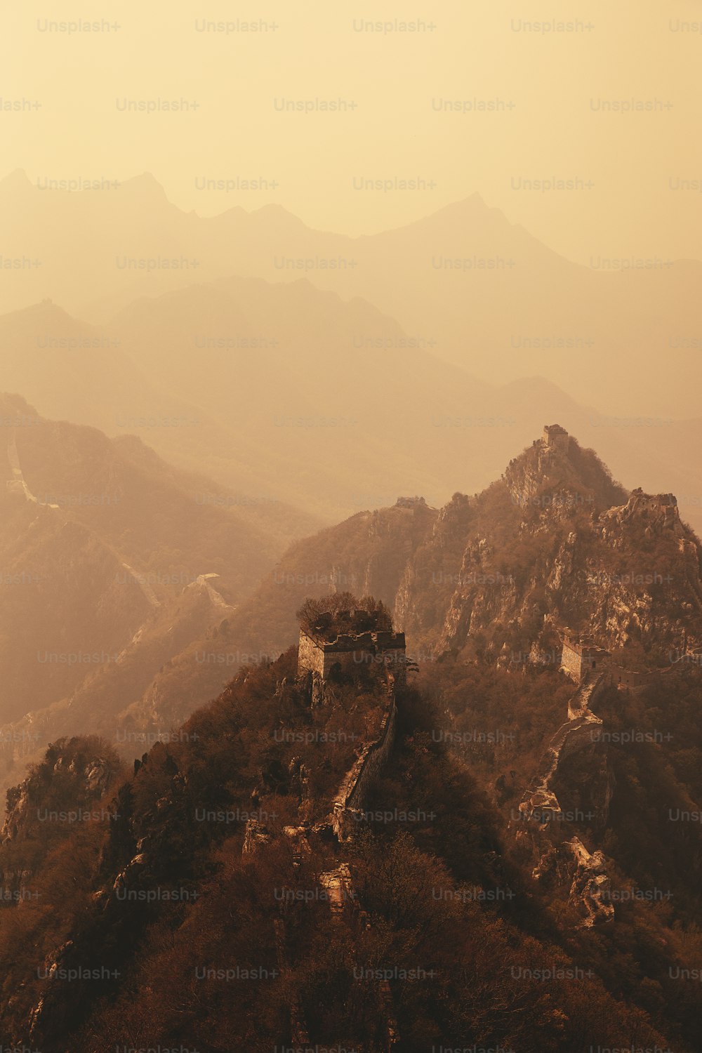 a view of the great wall of china from the top of a mountain