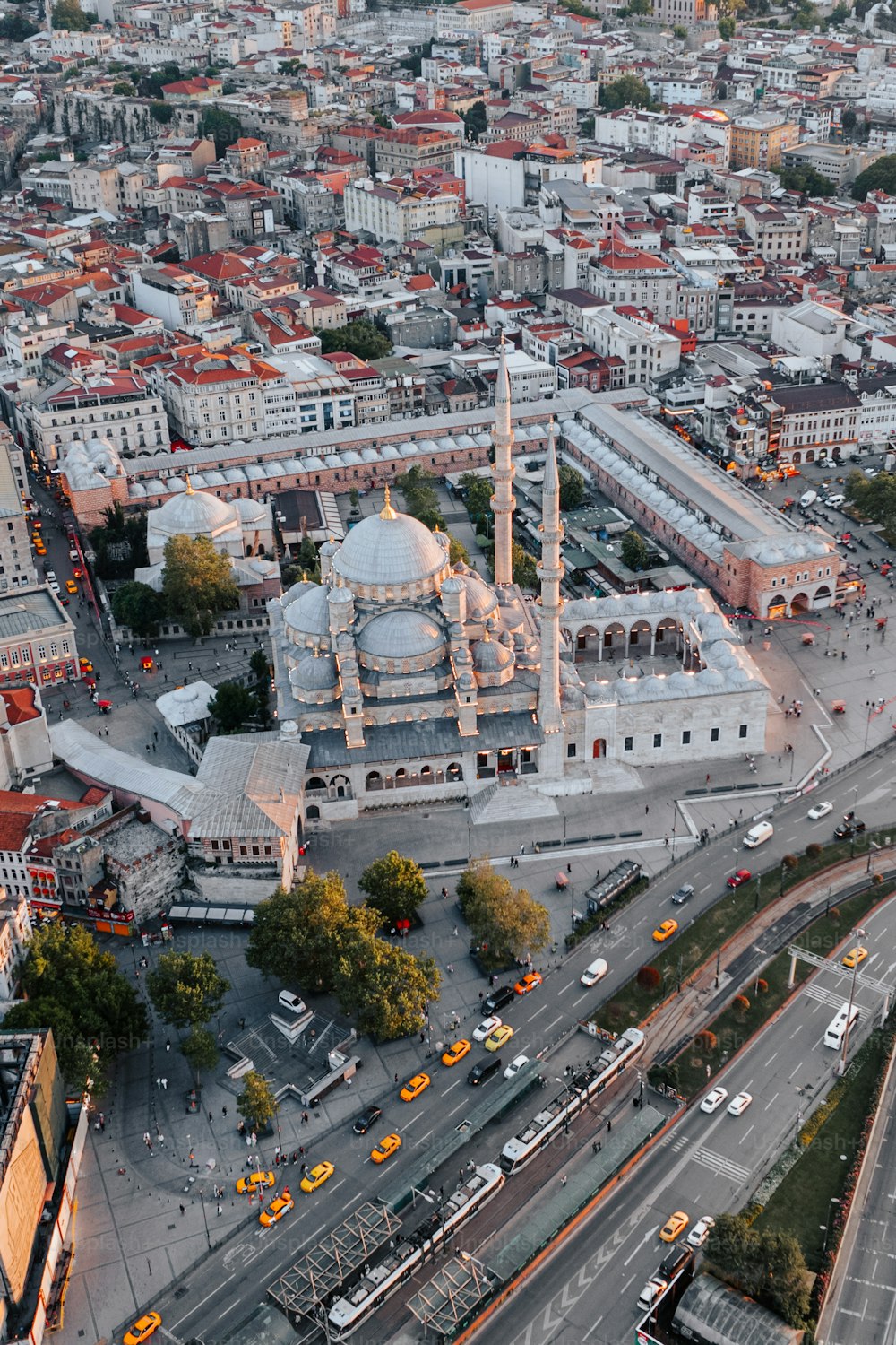 an aerial view of a city with a large white building