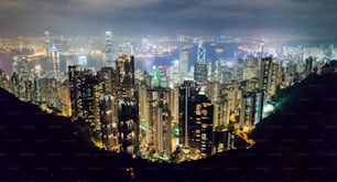 a view of a city at night from the top of a mountain