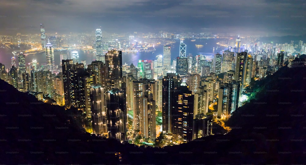 a view of a city at night from the top of a mountain